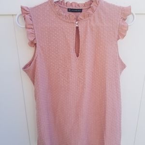 Cute pink top w/ raised dot design & ruffle detail.